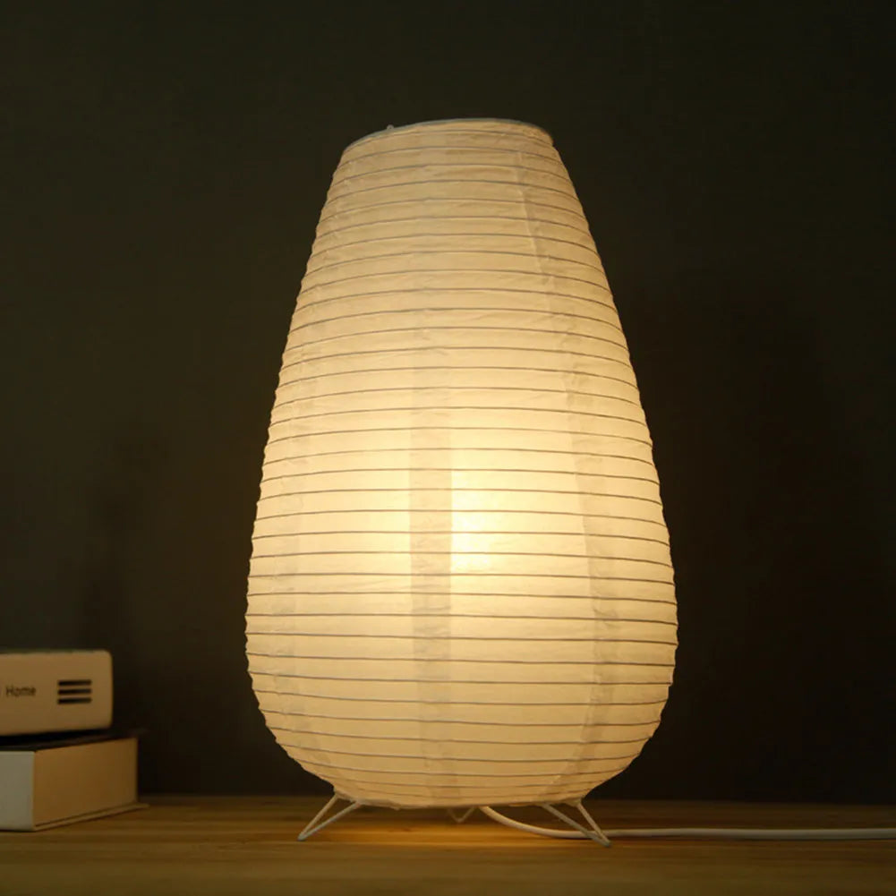 White rice paper plug-in table lamp with E14 bulb socket on wooden desk
