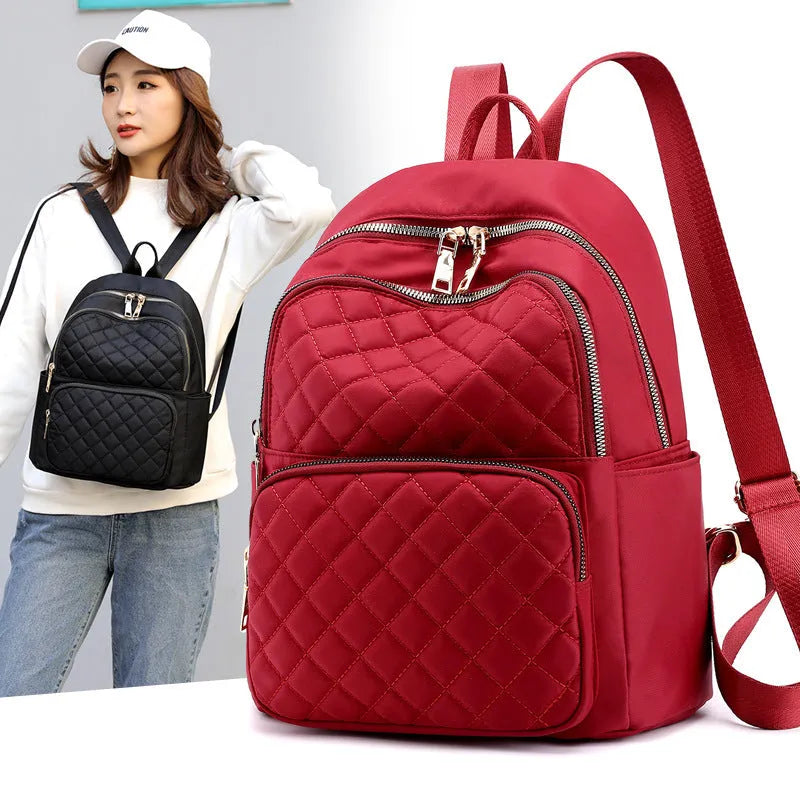 Women nylon embossing casual backpack with zipper closure and soft handle in black