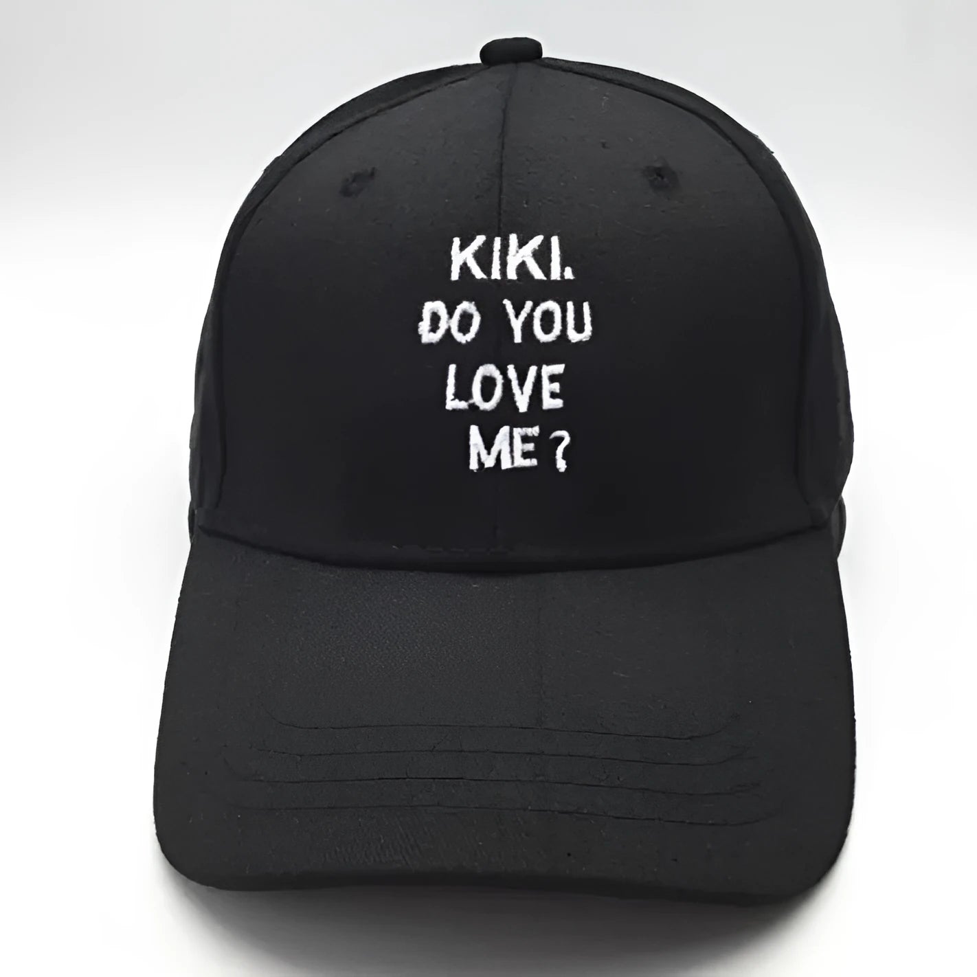 Black cotton baseball cap with white letter embroidery, curved brim, adult size