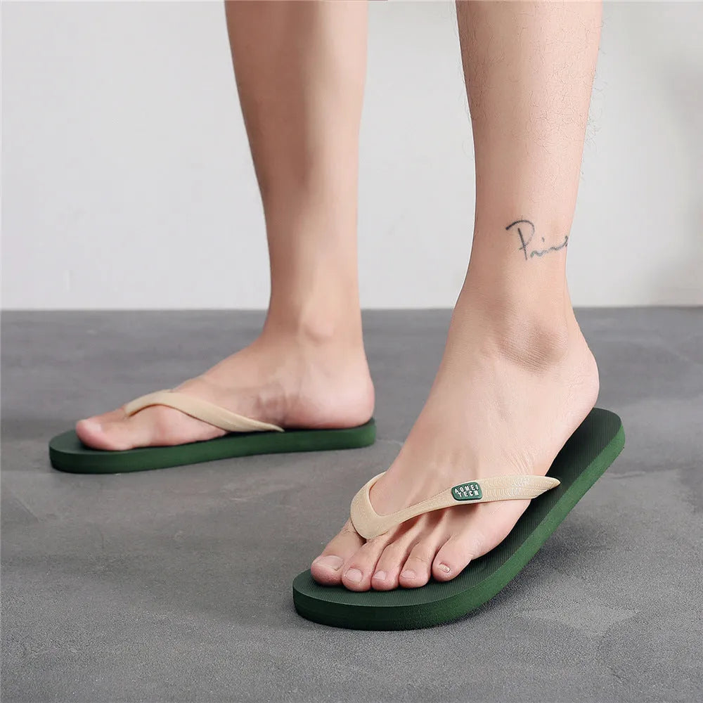 Men's black rubber flip-flop with vulcanised sole and EVA upper, shown from the side.