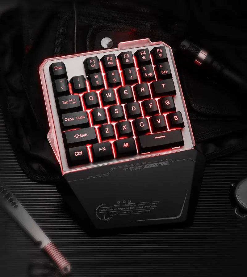 G40 Flow black one-handed mechanical keyboard with RGB backlit keys on a desk