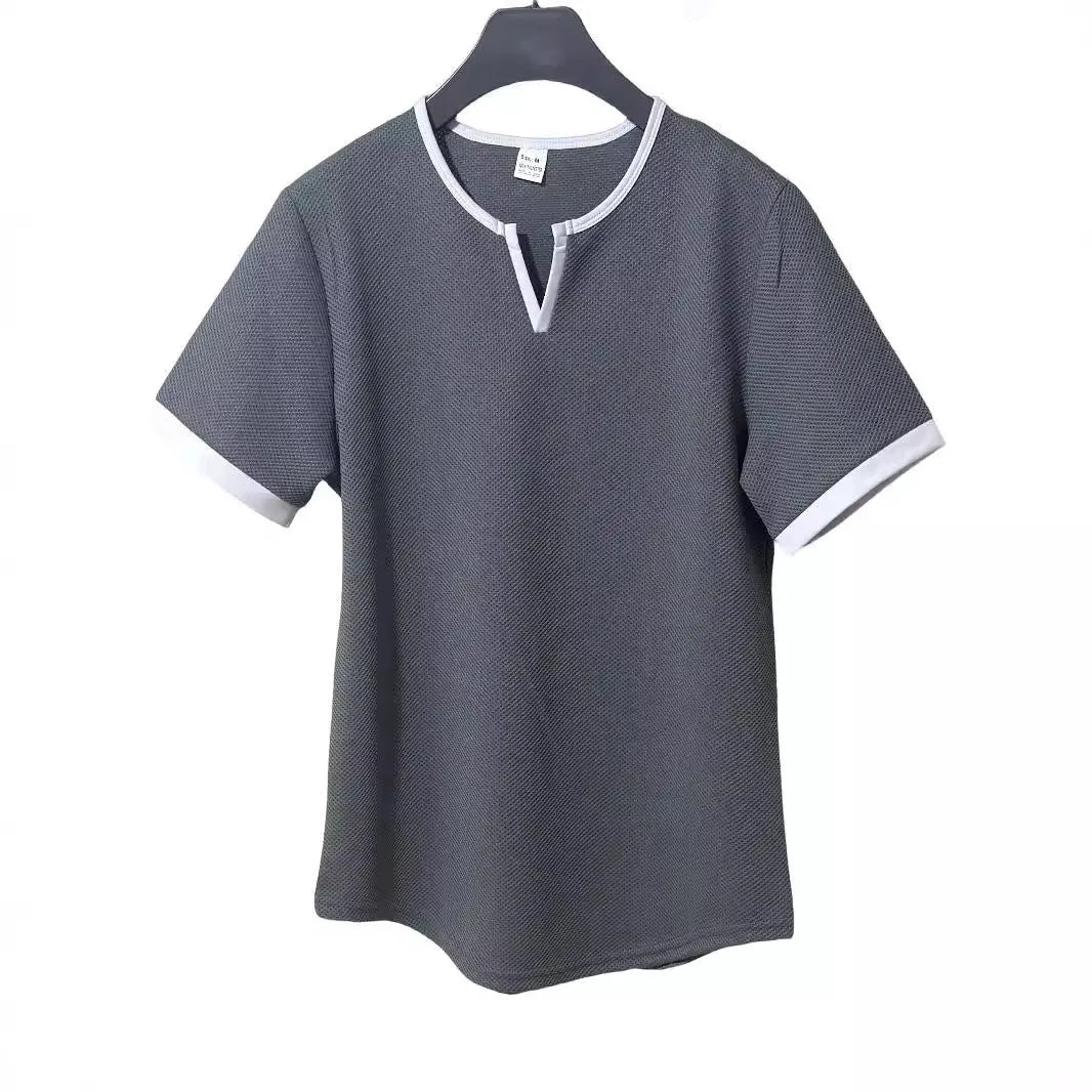 Colour-block waffle textured V-neck sports t-shirt in polyester on a size chart.