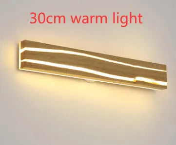 Solid wood LED wall light in log colour with rubber wood frame and acrylic panel