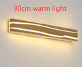 Solid wood LED wall light in log colour with rubber wood frame and acrylic panel