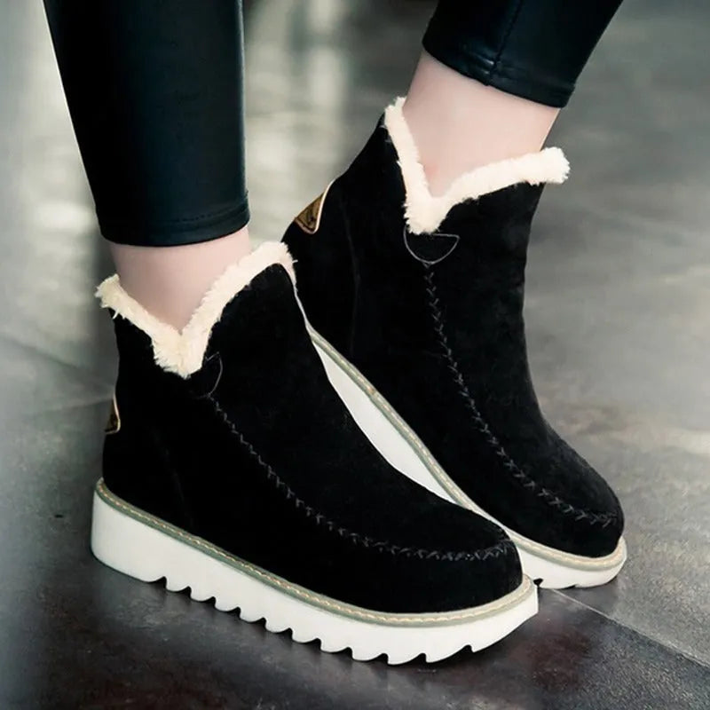 Women's winter snow boots in black with plush flannel lining, rubber sole, mid heel, round toe, ankle-high.
