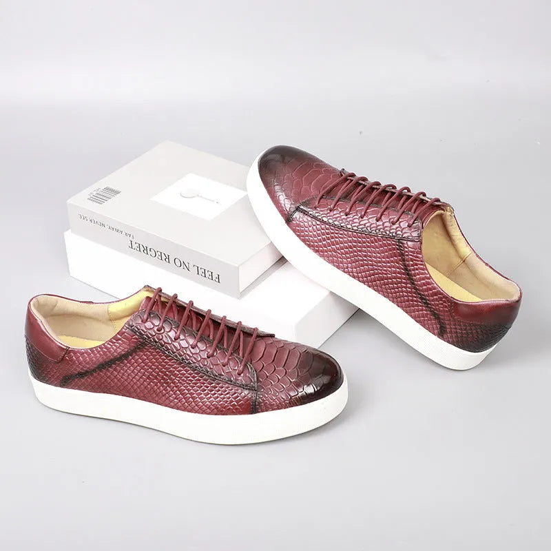 Men's lace-up embossed flat casual leather shoes in brick red with round toe and rubber sole