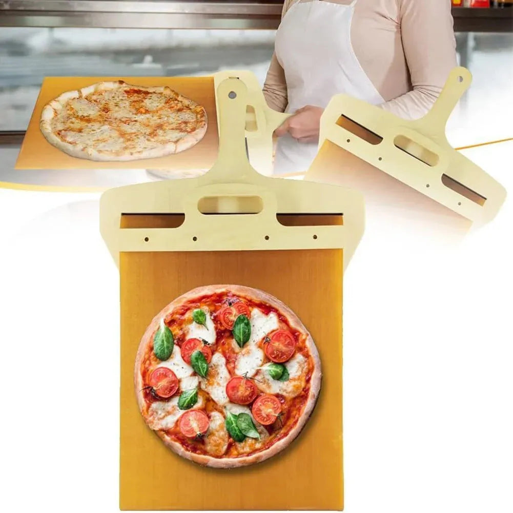 White plastic pizza transfer shovel on a kitchen counter, showing its flat board surface and handle with hanging hole.