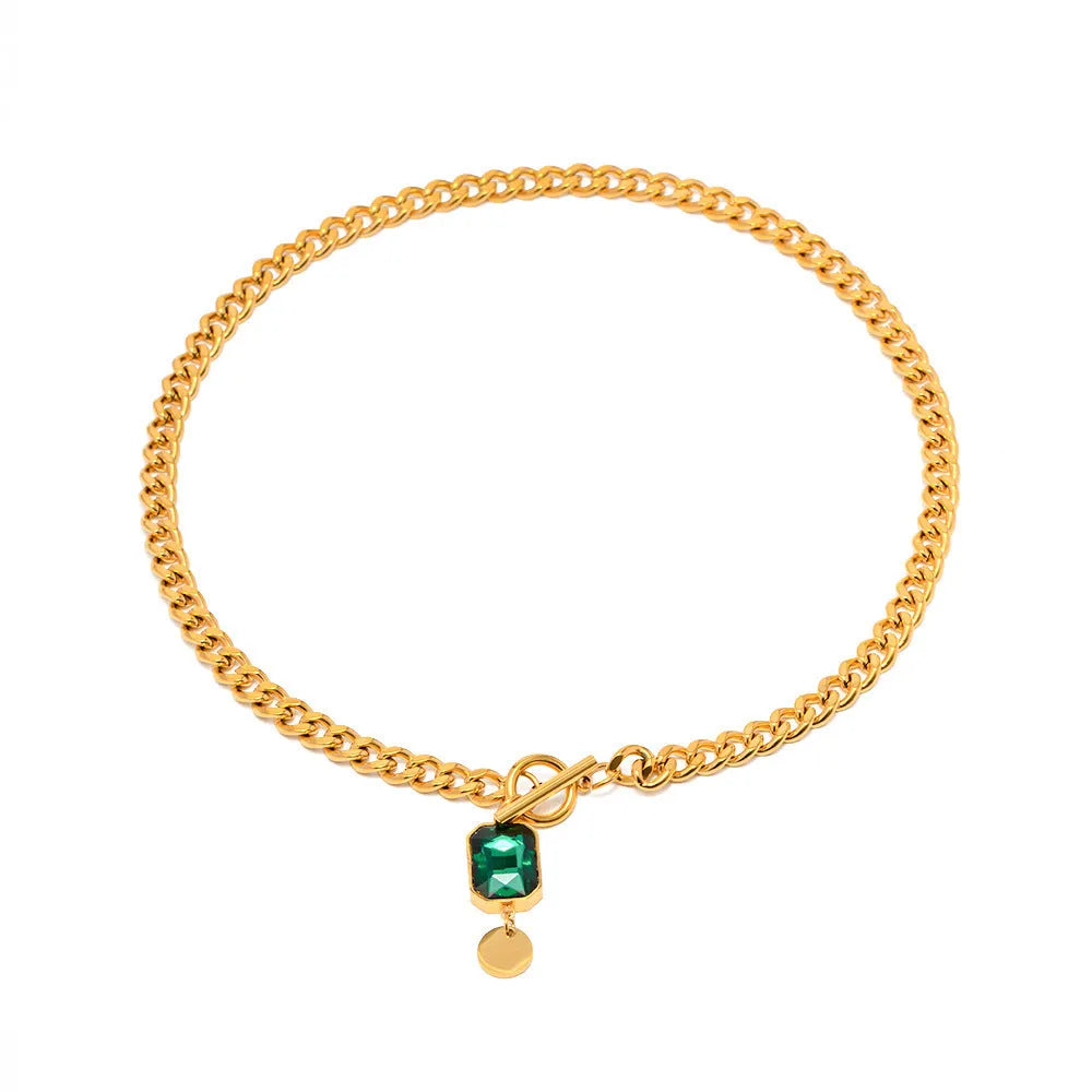 Gold geometric zircon pendant necklace with Cuban chain on white background