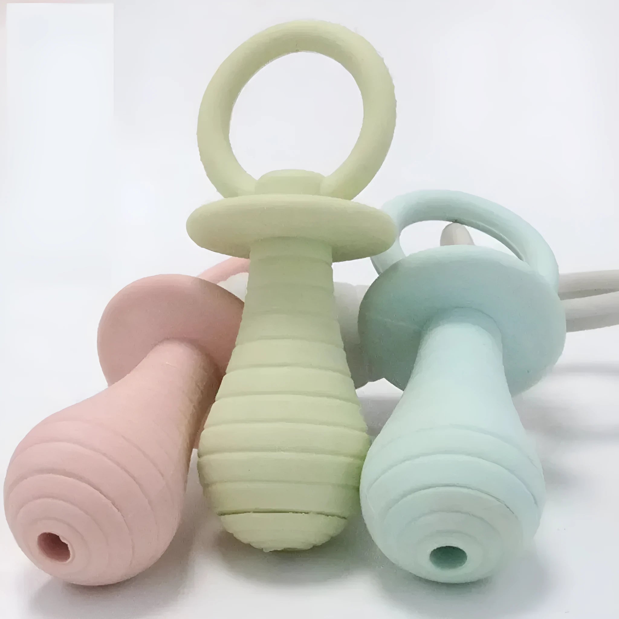Four coloured pet pacifier rubber toys with squeakers for puppies and kittens