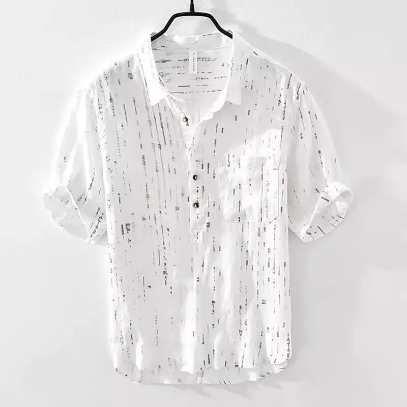 Mens loose-fit black polo shirt with a short sleeve and a V-neck lapel collar on a hanger.