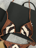Women's black and white floral bikini set with briefs style bottoms in polyester for summer swimming
