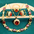 Gold plated jewellery set with colourful cubic zirconia stones, showing necklace, earrings, ring, and bracelet.