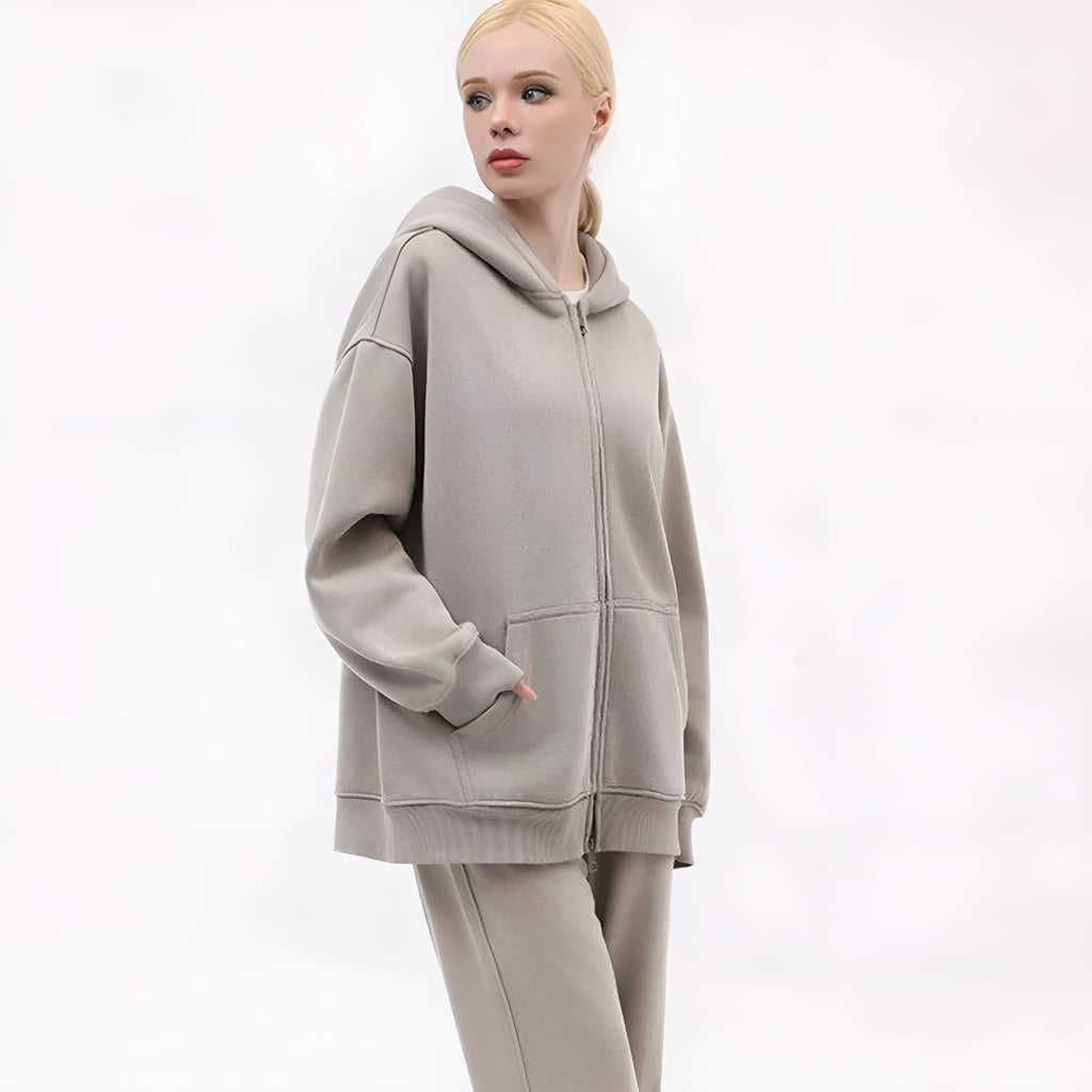 A women's loose-fit hooded cardigan sweater in a distressed colour, showing patch pockets and drop-shoulder sleeves.