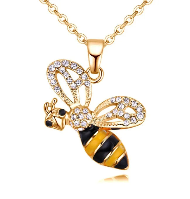 Cartoon bee drop pendant necklace with oil studded alloy finish on cross chain, yellow colour option, on white background