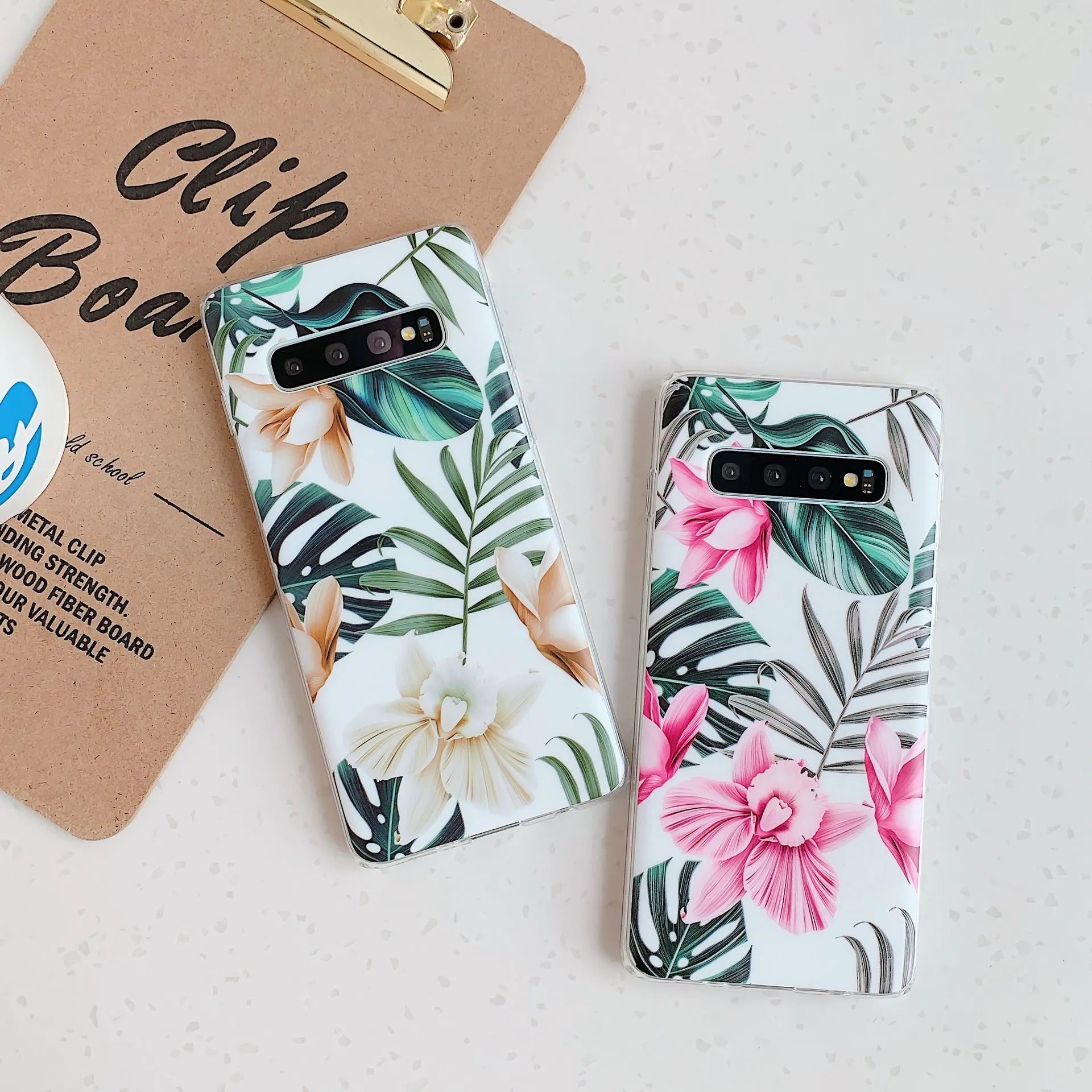 Samsung TPU phone case with green leaf flower design on a Safflower coloured back cover.