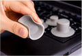 Grey plastic laptop cooling pad set showing two large and two small pads on a wooden desk.