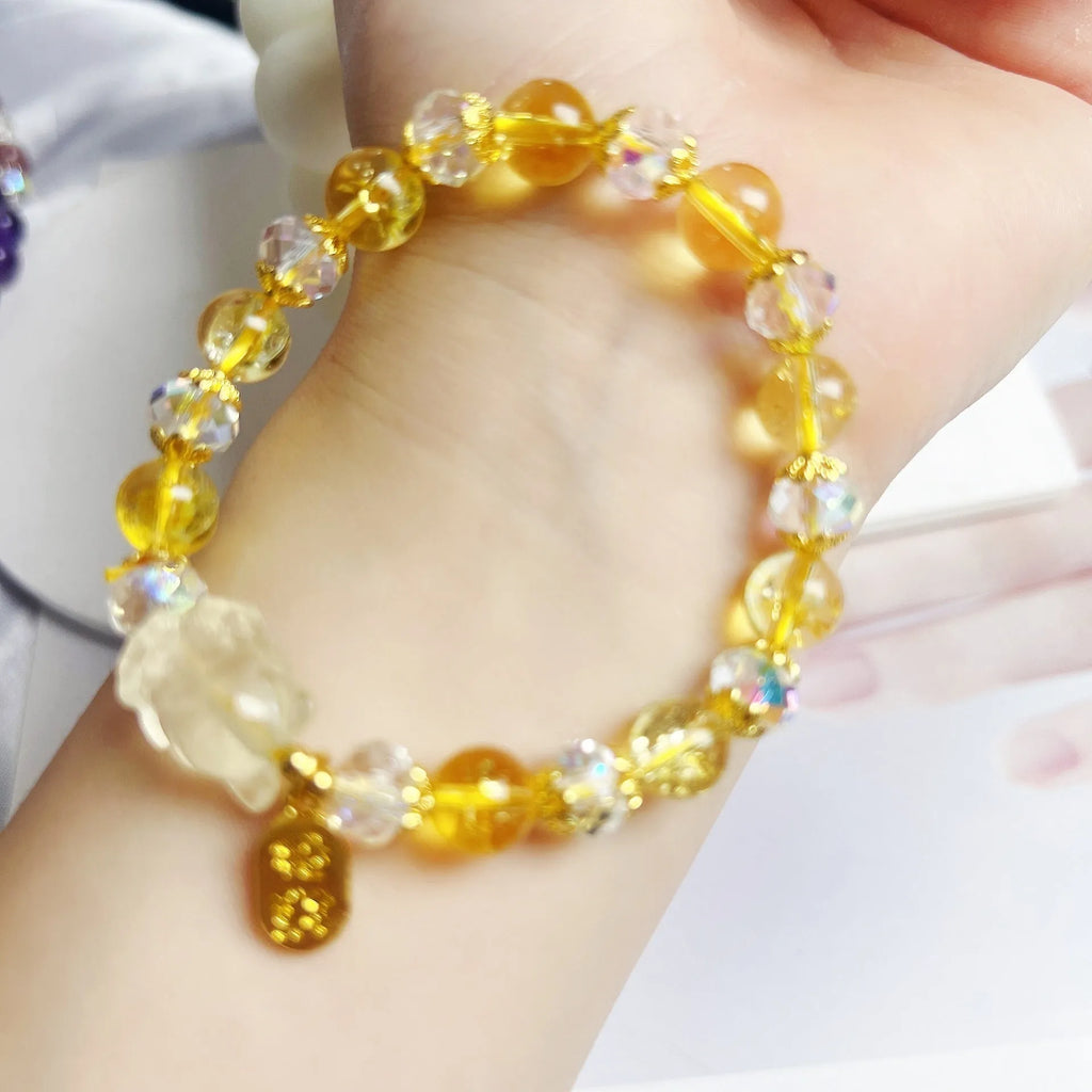 Handmade women's bracelet featuring a nine-tail fox design made from natural citrine crystals.