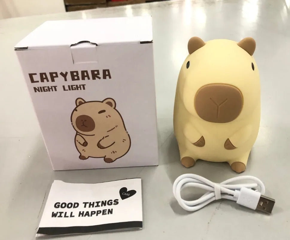 Cute capybara-shaped small night lamp on a table, showing its size and design.
