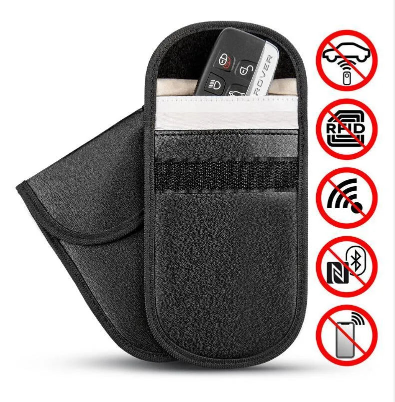 Black plain microfiber faraday cage bag for blocking RFID and phone signals, shown with a key fob inside.