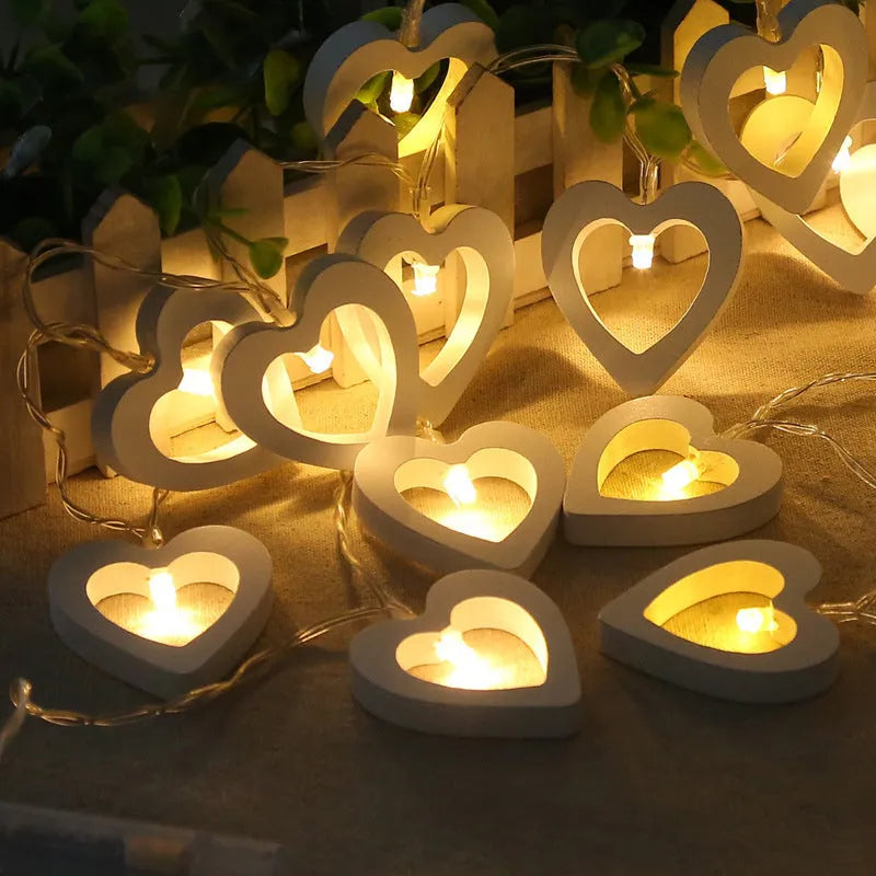 Wooden love lantern string with warm white LEDs on a USB battery cable