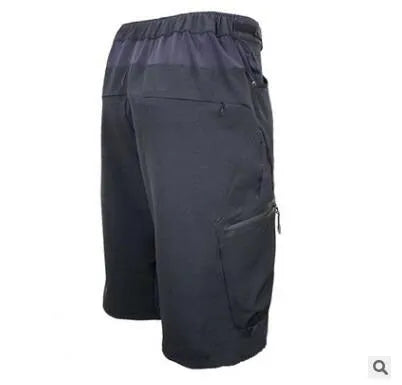Outdoor cycling shorts in black with elastic waistband and side pockets on a plain background