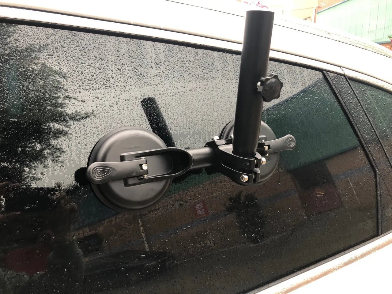 Black ABS car flagpole sucker mount with round glass suction cup for off-road vehicles.