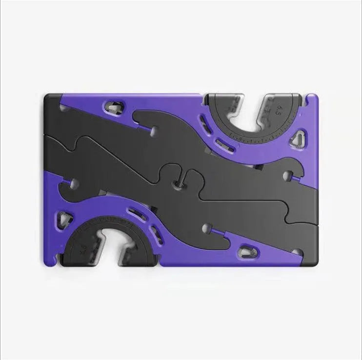 Plastic card type mobile phone holder in various colours on a desktop.