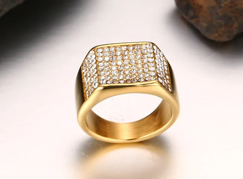 Gold titanium steel men's ring with geometric diamond-treated surface, available in sizes 7 to 12.