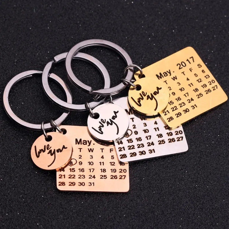Custom engraved stainless steel calendar keychain with date, gold plating, 30x30mm, on a white background