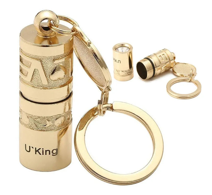 Gold zinc alloy waterproof LED flashlight attached to a keyring.