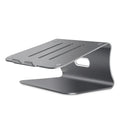 Silver aluminium laptop cooling stand with striped texture and 360-degree rotating base on a wooden desk.