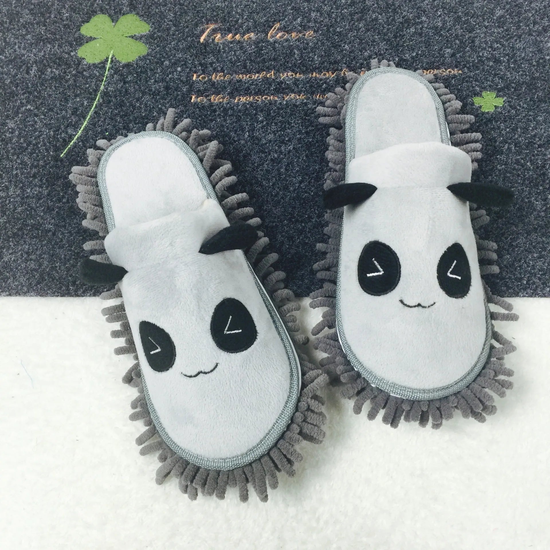 Brown animal print slippers with a removable panda face design on a coral fleece upper.