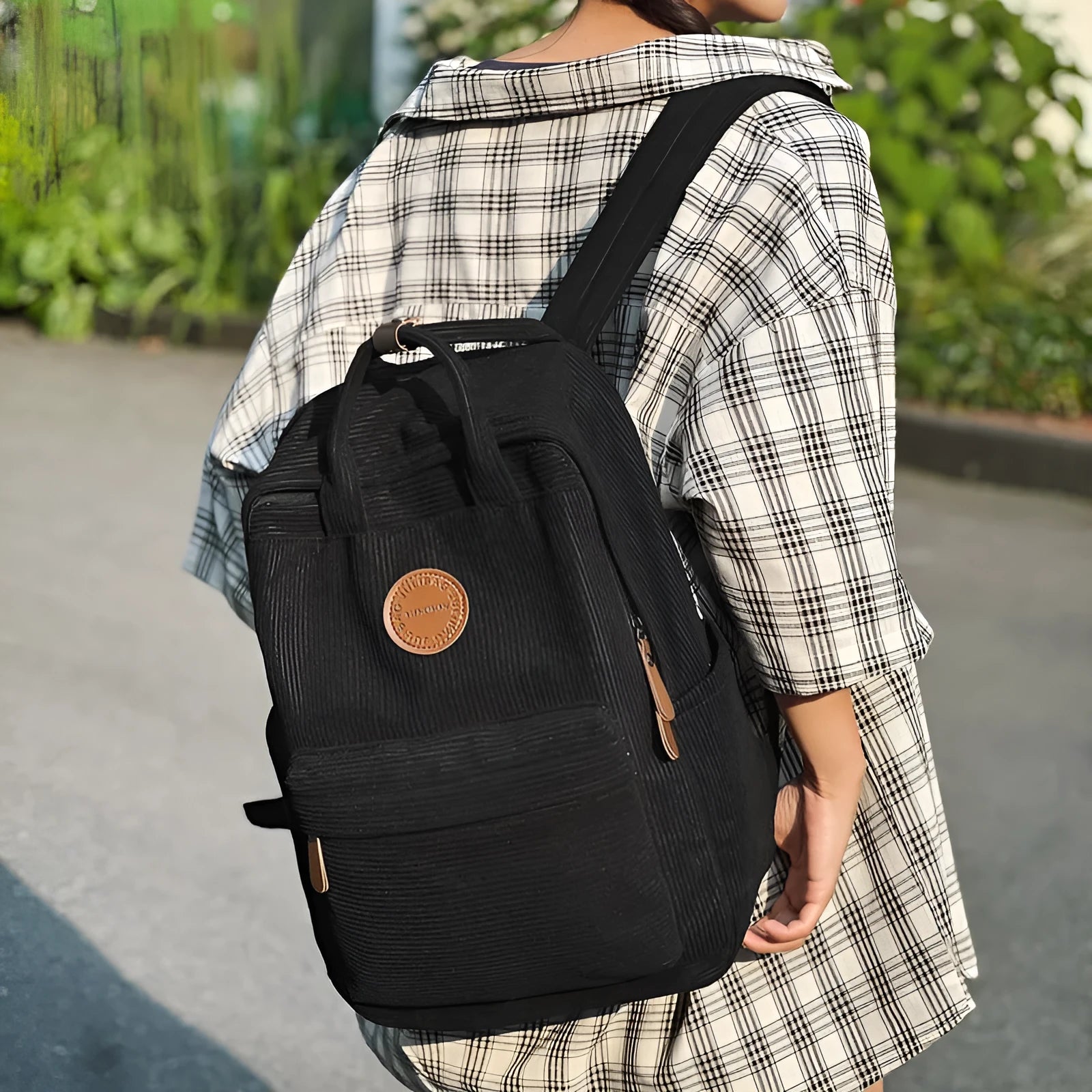 Retro unisex corduroy backpack in solid colour with breathable fabric, side view.