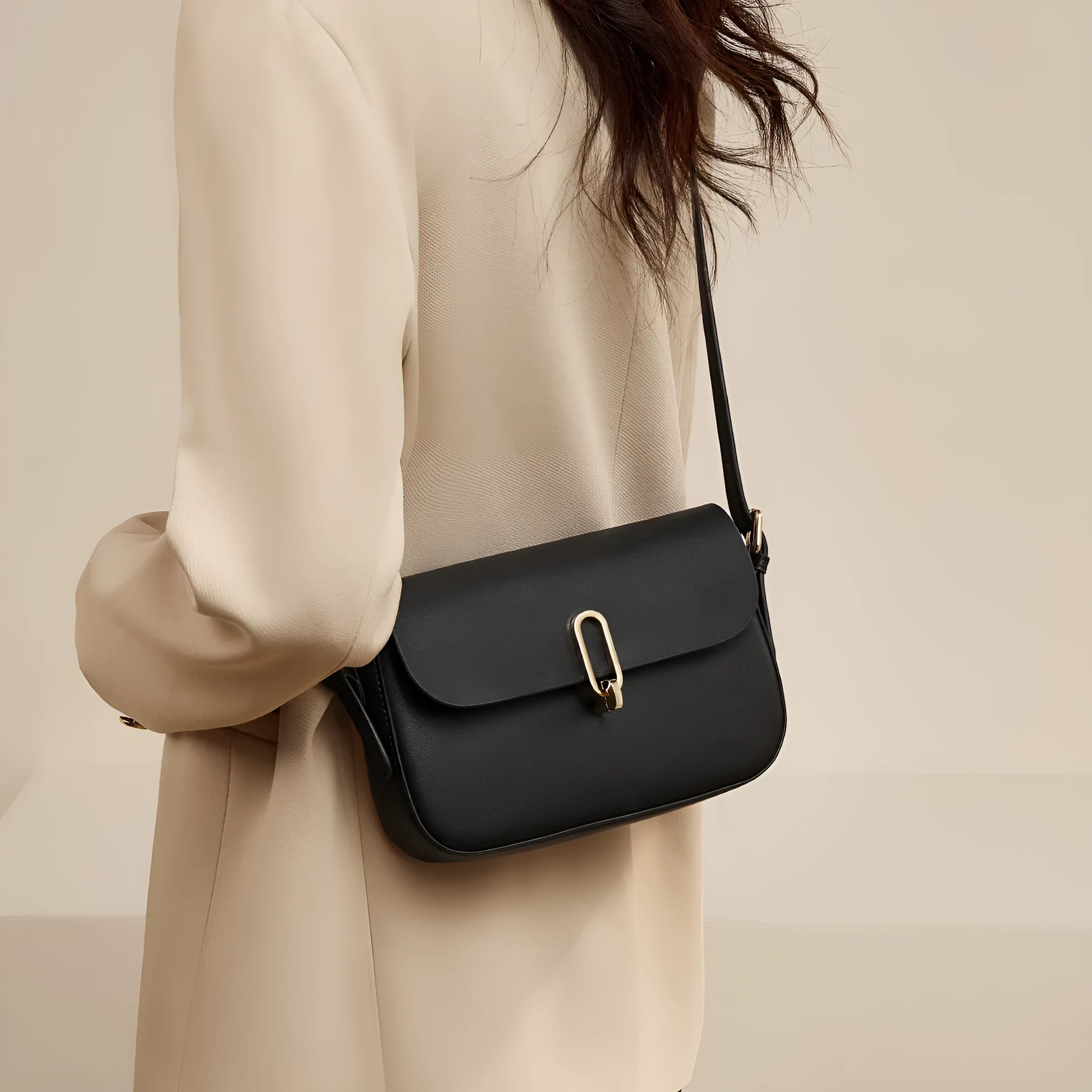 Black genuine leather square messenger bag with lock closure and shoulder strap