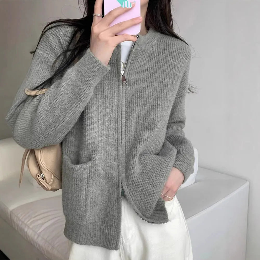 Beige viscose fibre long sleeve sweater coat cardigan laid flat.