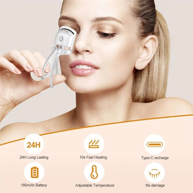 Pink and white USB rechargeable heated eyelash curler with dual temperature settings.