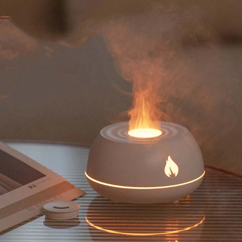 Black flame effect humidifier diffuser with LED lights on a wooden surface