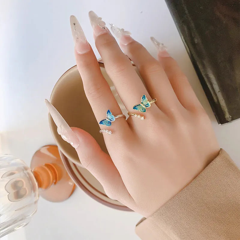 Copper butterfly ring with blue epoxy inlay, adjustable opening, silver colour, simple animal style