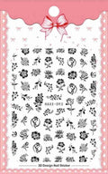 Black butterfly nail stickers with white flower and gold accents on a manicured hand, adhesive decal set