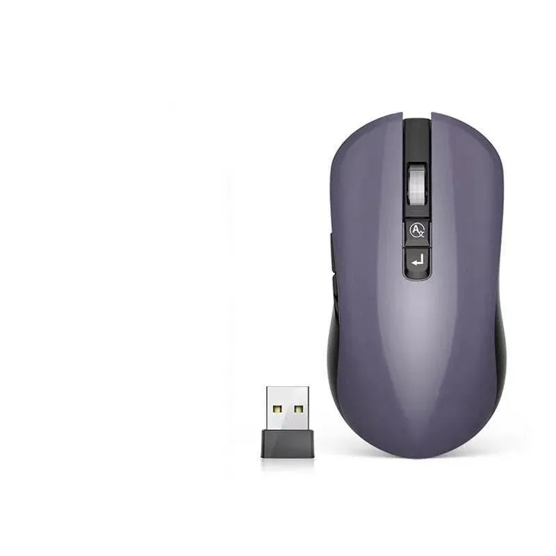 IFLYTEK wireless gaming mouse with voice control on a black mouse mat next to a laptop.