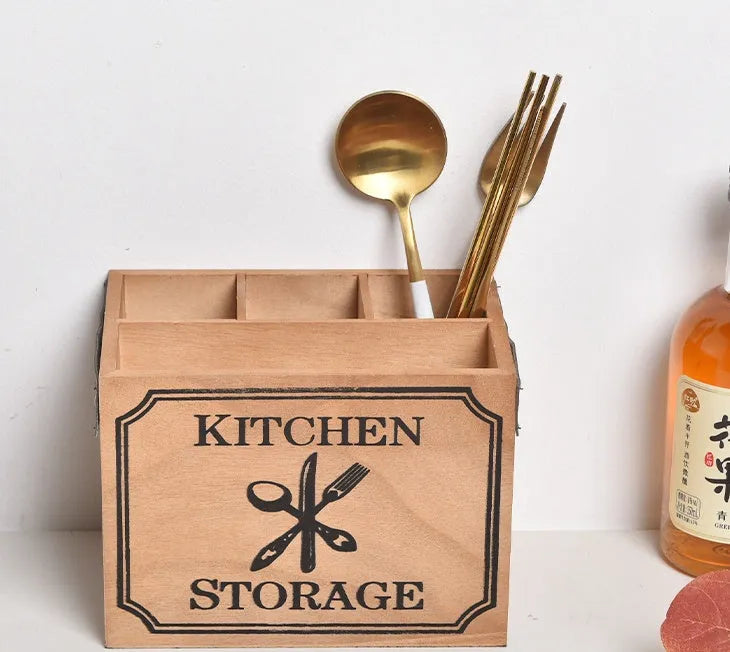 Wooden kitchen storage box with grid compartments for knives, forks, and chopsticks.