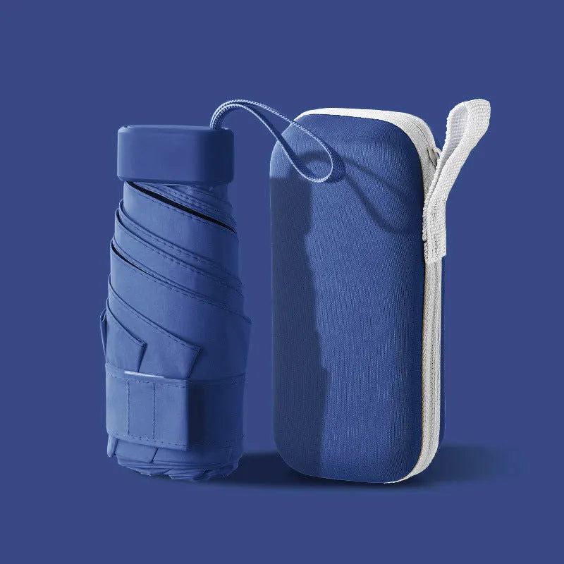 Ultra-light six-fold flat capsule sun protection umbrella in sky blue with manual open mode and rubber handle.