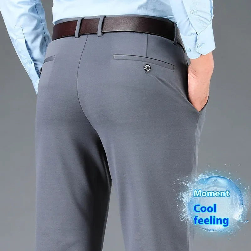 Men's straight-leg suit trousers in black elastic fabric, shown on a hanger.