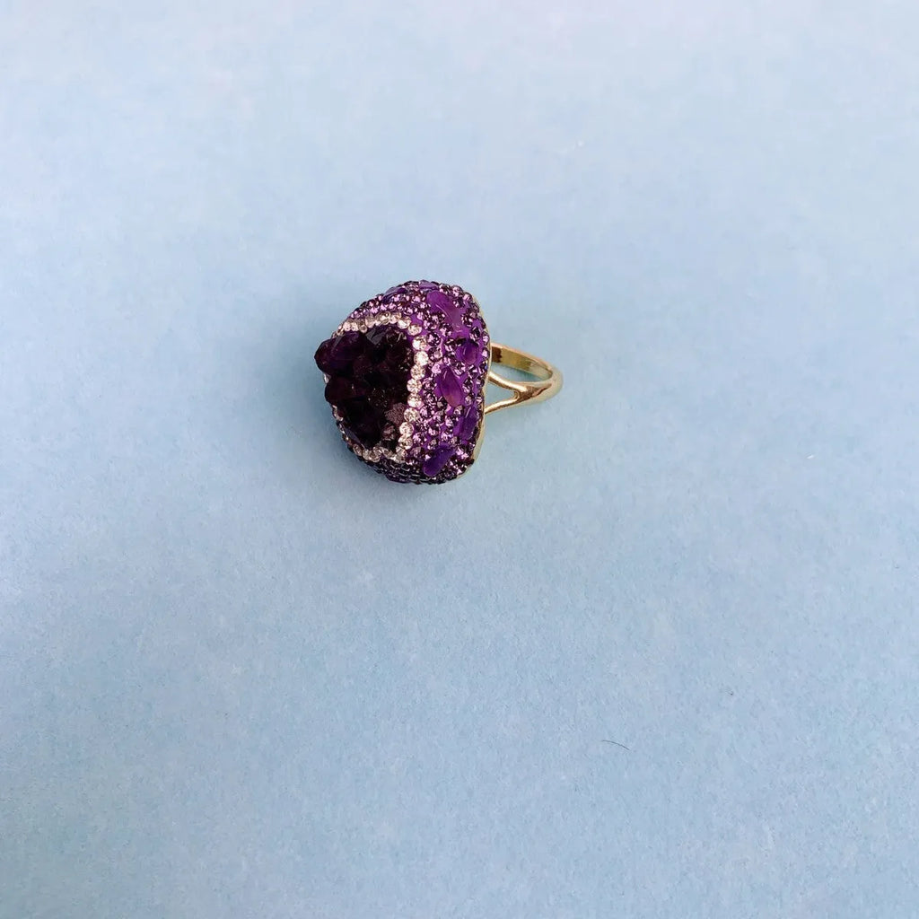 Natural Uruguay amethyst open adjustable ring in deep purple colour on a clean background