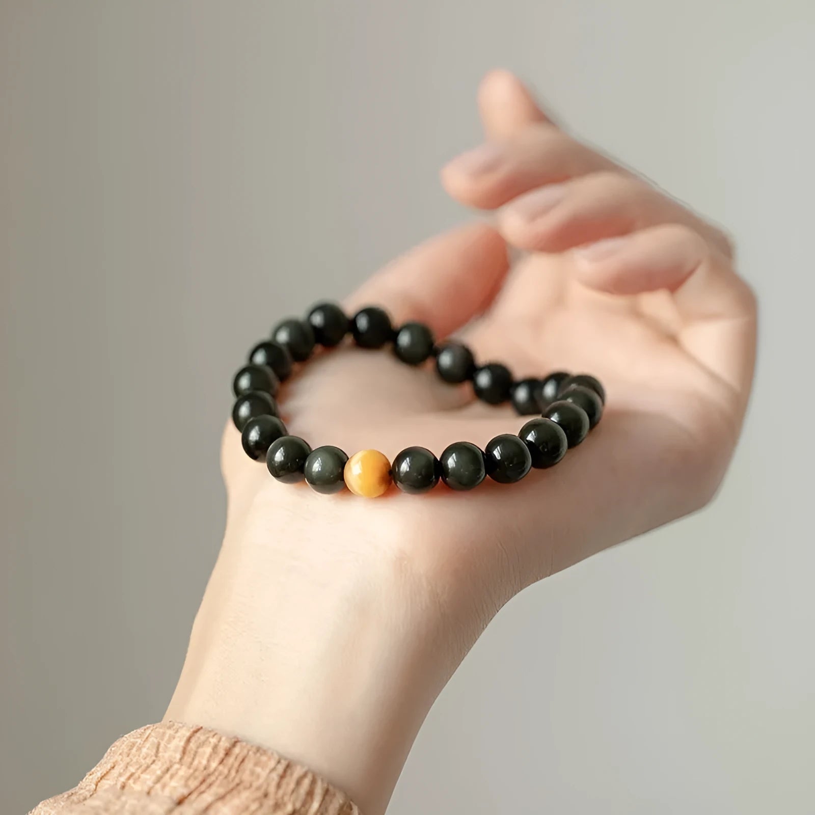Black obsidian stone bracelet with geometric beads in Korean unisex style.