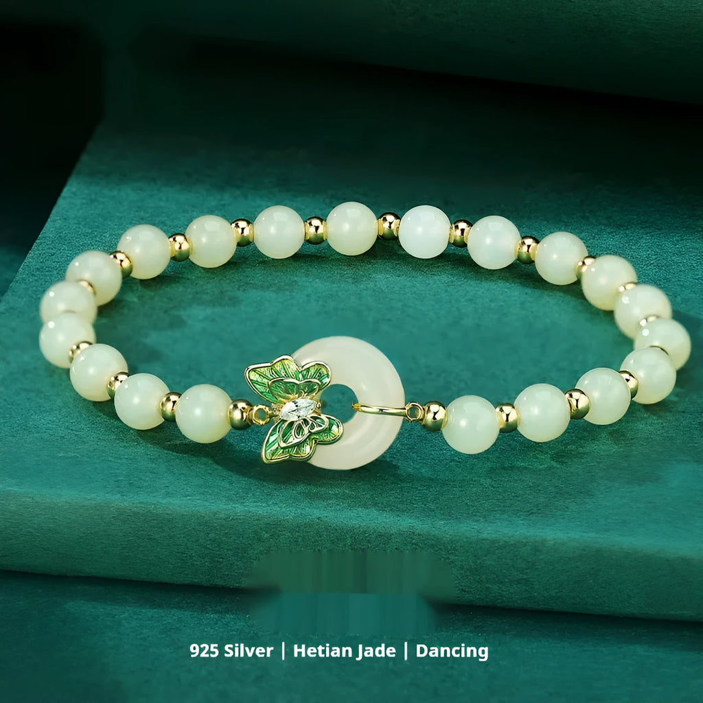 Cyan Hetian Jade bracelet with butterfly design and sterling silver accents, 6mm bead size
