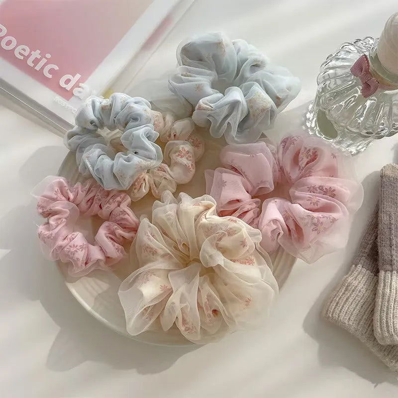 Mesh sense bun cloth hair band for women in milky white, pink, and light blue with large intestine style