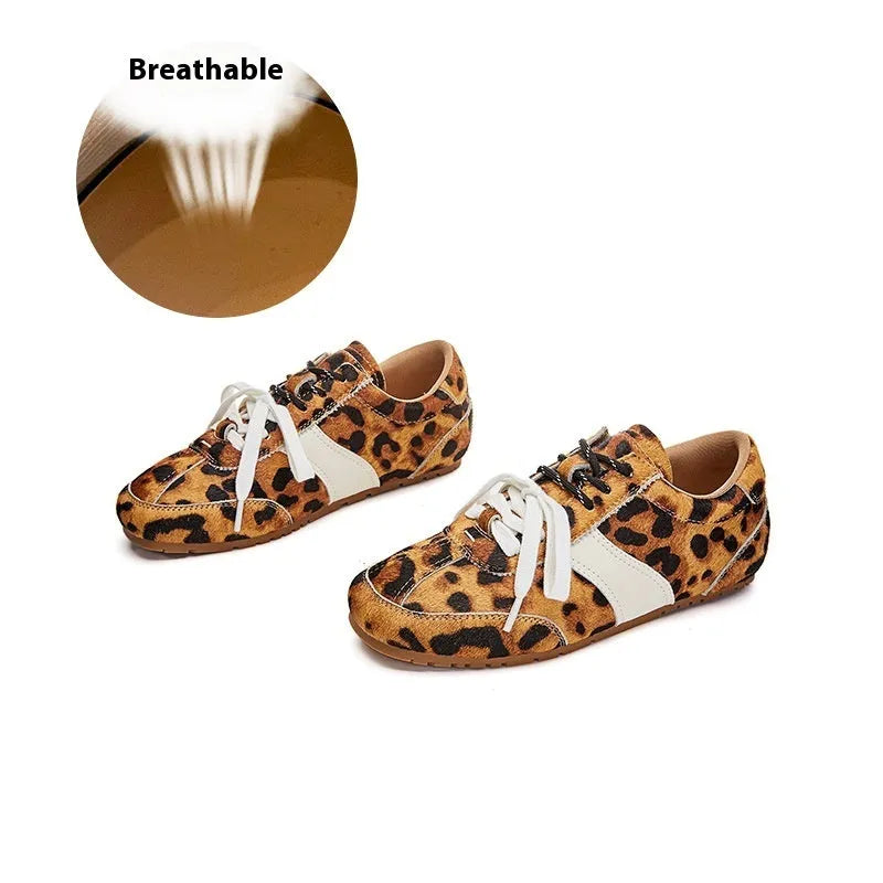 Women's white flat lace-up shoes with decorative horsehair flocking on the upper and a round toe.