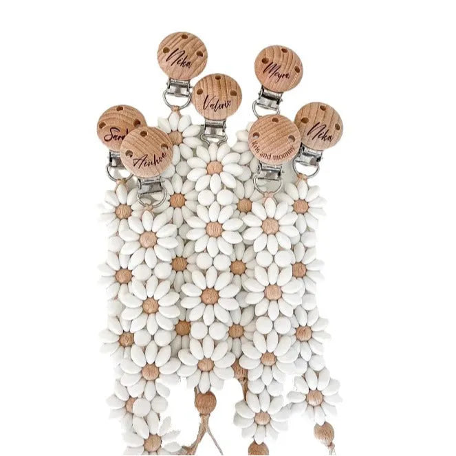 Baby flower silicone pacifier clip in pink on white background with custom name option