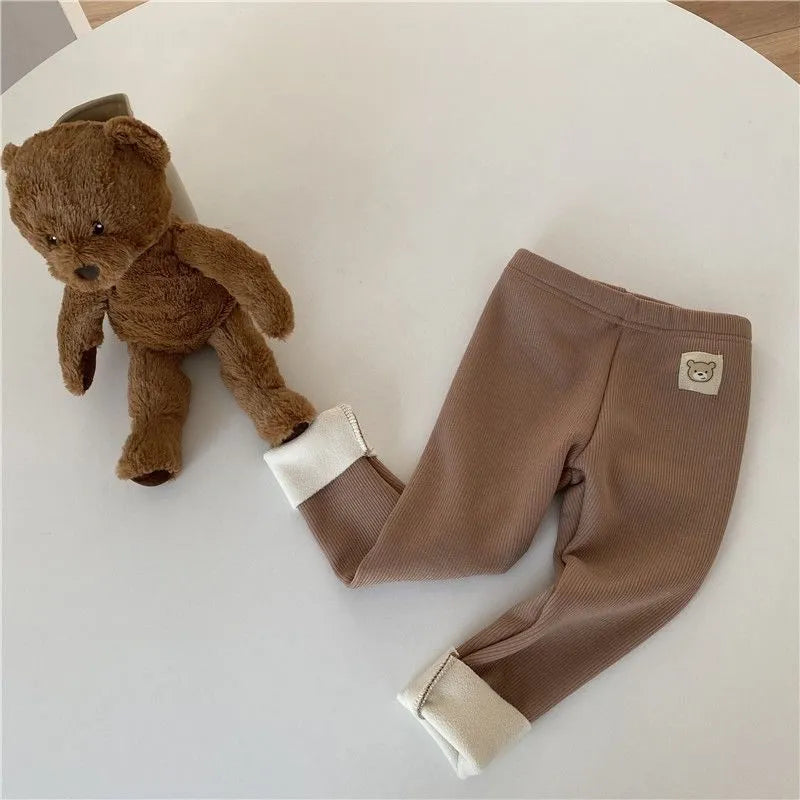 Girls' high-waist fleece-lined leggings in beige, black, brown, and grey colours on a size chart.